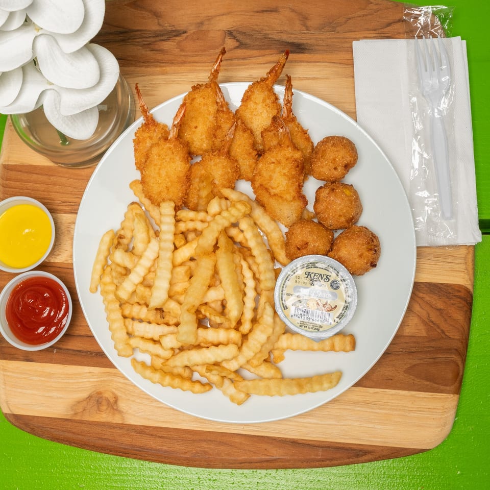 Fried shrimp combo with crinkle-cut fries, hush puppies, tartar sauce, ketchup, and mustard.